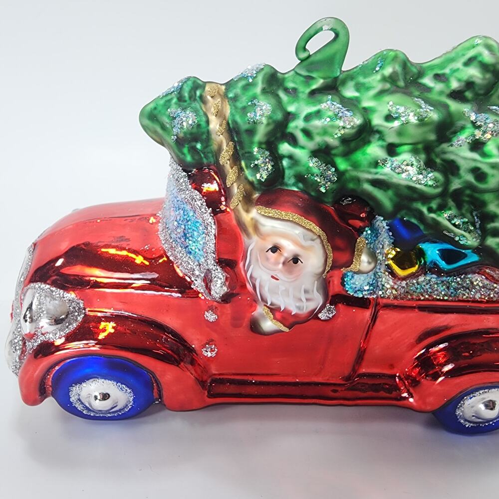 Glass Blown Santa in Red Truck Christmas Ornament